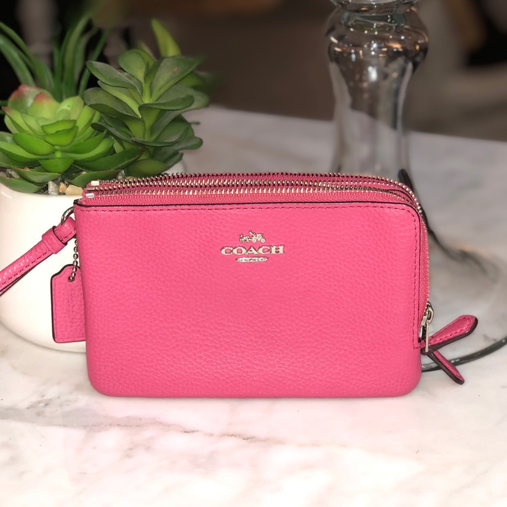 Coach pink pebbled leather double zip wristlet. 😎